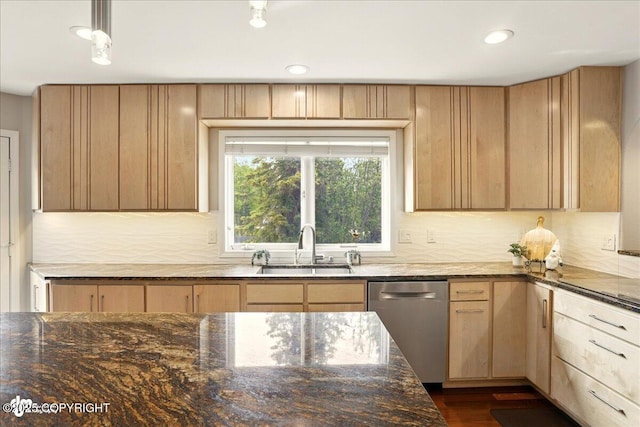 3833 Eastwind Dr, Anchorage, AK 99516 - kitchen with stainless steel dishwasher, light brown cabinets, a sink, dark stone counters, and backsplash