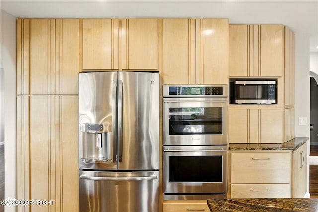 3833 Eastwind Dr, Anchorage, AK 99516 - kitchen featuring stainless steel appliances, light brown cabinets, and dark stone counters