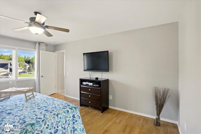 3833 Eastwind Dr, Anchorage, AK 99516 - bedroom with baseboards, light wood-style flooring, and a ceiling fan