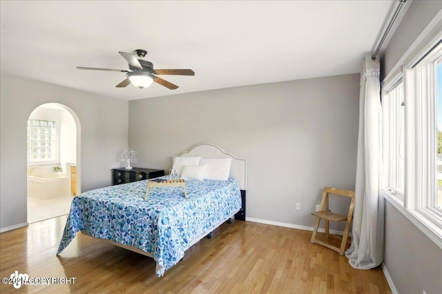 3833 Eastwind Dr, Anchorage, AK 99516 - bedroom featuring multiple windows, wood finished floors, and baseboards