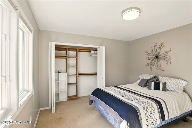 3833 Eastwind Dr, Anchorage, AK 99516 - bedroom featuring light colored carpet, multiple windows, baseboards, and a closet