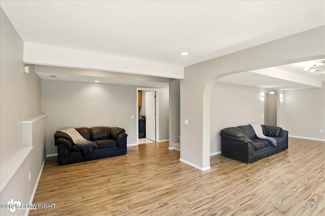 3833 Eastwind Dr, Anchorage, AK 99516 - living area with light wood-type flooring, arched walkways, baseboards, recessed lighting, and washer / clothes dryer
