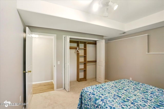 3833 Eastwind Dr, Anchorage, AK 99516 - bedroom featuring light colored carpet, a closet, and baseboards