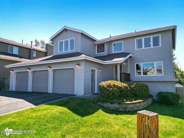 3833 Eastwind Dr, Anchorage, AK 99516 - view of front of house with asphalt driveway, a front yard, and an attached garage