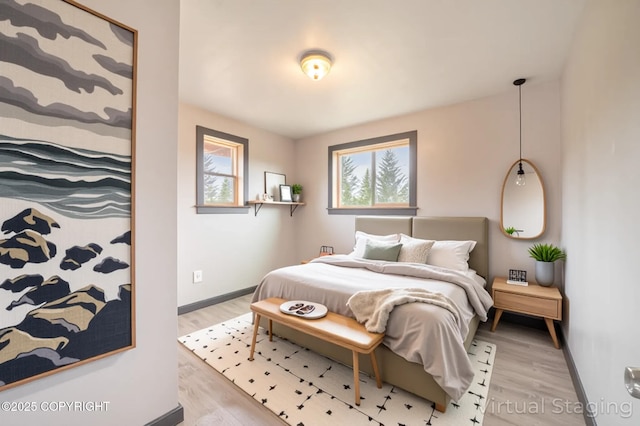 33533 Alder St, Anchor Point, AK 99556 - bedroom featuring light wood-style flooring and baseboards