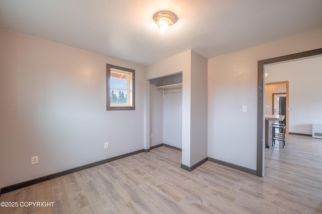 33533 Alder St, Anchor Point, AK 99556 - unfurnished bedroom with light wood-type flooring, baseboards, and a closet