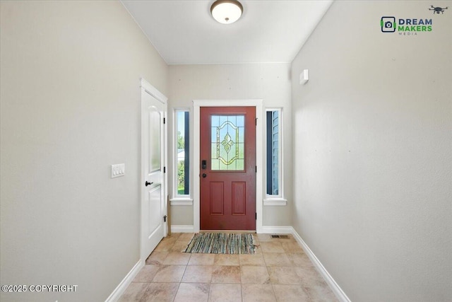 7782 W Arlie Rd, Wasilla, AK 99623 - foyer entrance featuring baseboards and light tile patterned flooring