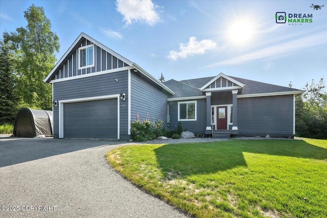 7782 W Arlie Rd, Wasilla, AK 99623 - view of front of house featuring a front yard and asphalt driveway