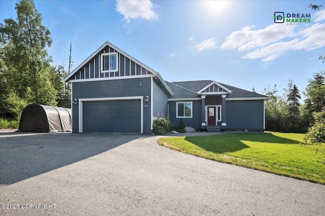 7782 W Arlie Rd, Wasilla, AK 99623 - craftsman-style home with a front lawn, asphalt driveway, and an attached garage