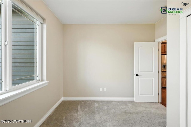 7782 W Arlie Rd, Wasilla, AK 99623 - carpeted empty room featuring baseboards