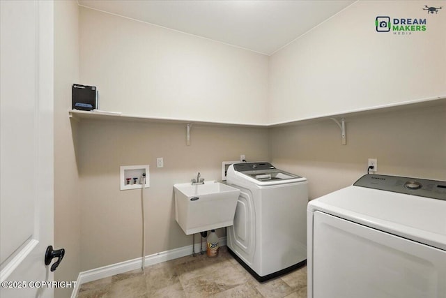 7782 W Arlie Rd, Wasilla, AK 99623 - laundry room featuring washer and dryer and baseboards