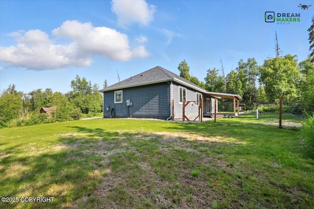 7782 W Arlie Rd, Wasilla, AK 99623 - view of side of home featuring a yard