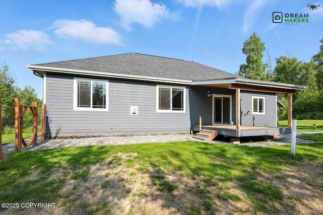 7782 W Arlie Rd, Wasilla, AK 99623 - rear view of property with a yard, a wooden deck, and a shingled roof