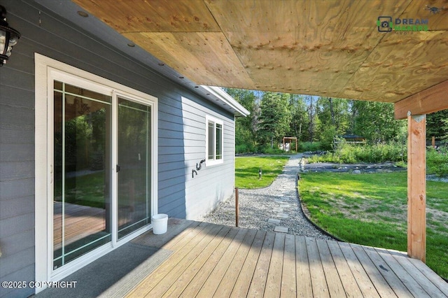 7782 W Arlie Rd, Wasilla, AK 99623 - wooden deck with a yard