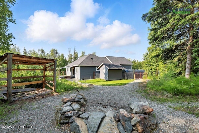 7782 W Arlie Rd, Wasilla, AK 99623 - view of property exterior with a storage unit