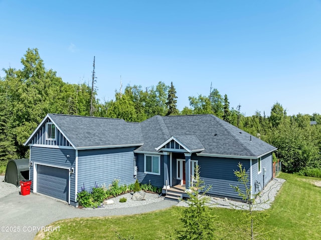 7782 W Arlie Rd, Wasilla, AK 99623 - view of front facade with a shingled roof, a front yard, and driveway