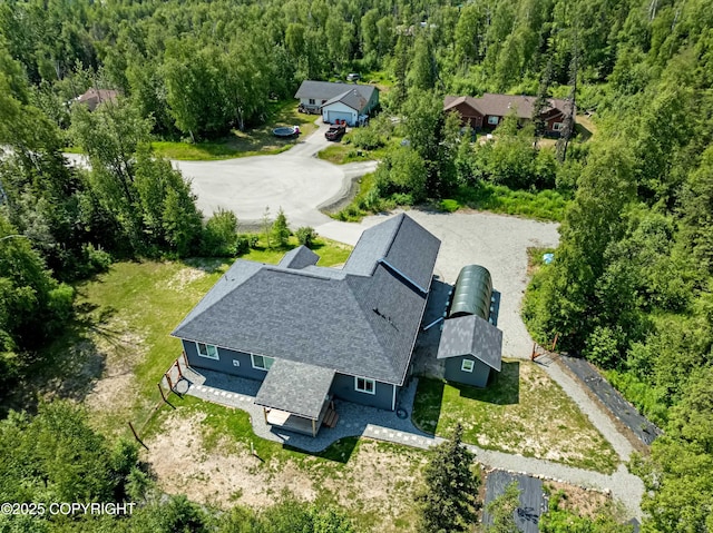 7782 W Arlie Rd, Wasilla, AK 99623 - aerial view of property and surrounding area with a heavily wooded area