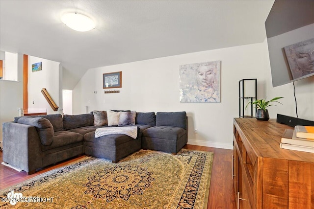 living area with dark wood-style floors and baseboards
