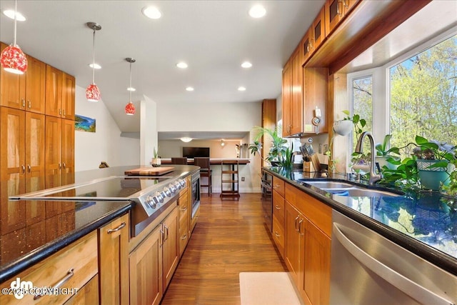 kitchen with dishwasher, a sink, recessed lighting, dark wood-type flooring, and brown cabinetry