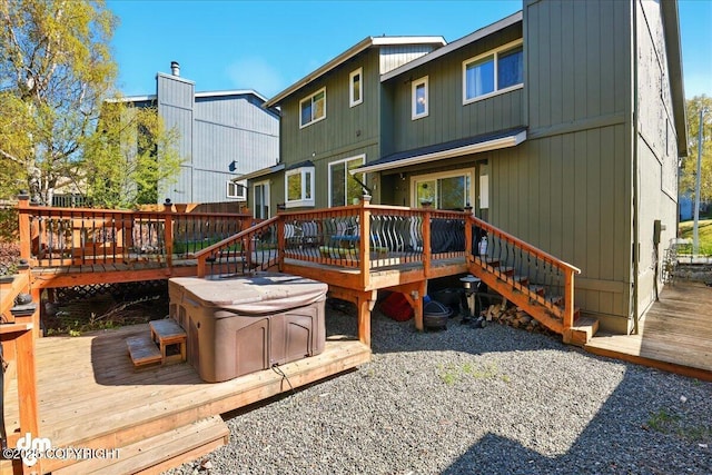 rear view of property featuring a deck