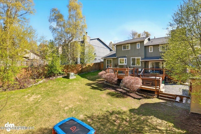 back of property featuring a wooden deck