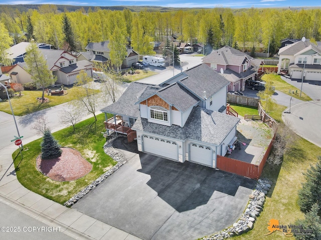 aerial perspective of suburban area with a heavily wooded area