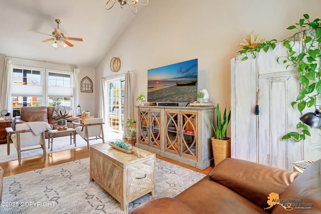 living room with high vaulted ceiling, wood finished floors, and ceiling fan