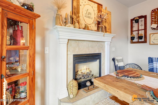dining room with a tile fireplace