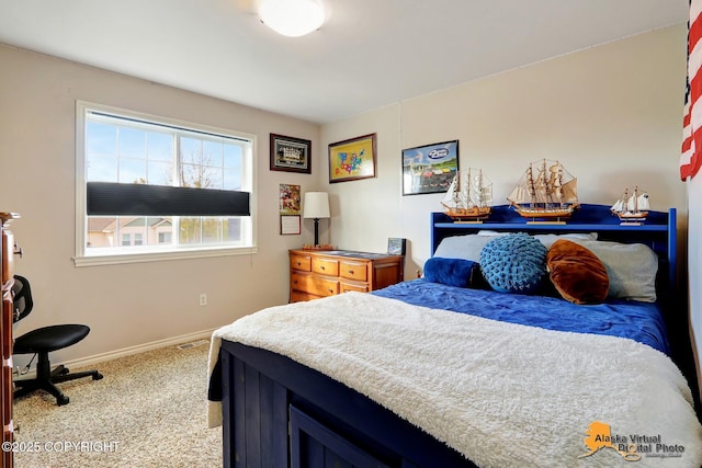 carpeted bedroom featuring baseboards