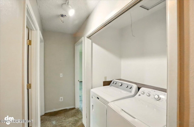 laundry room featuring washer and clothes dryer and carpet
