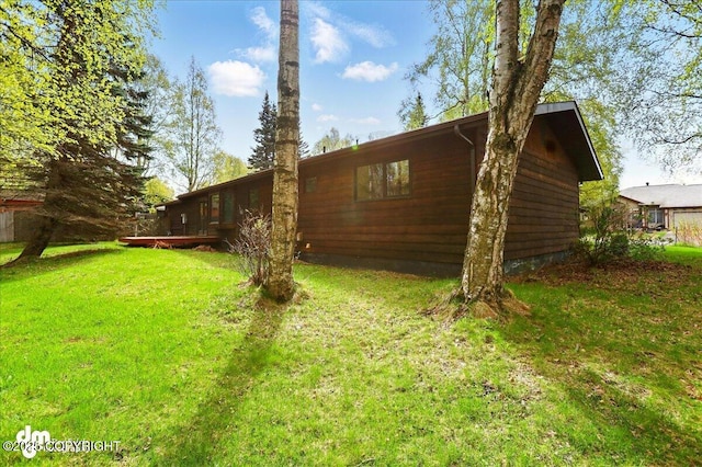 view of property exterior with a yard