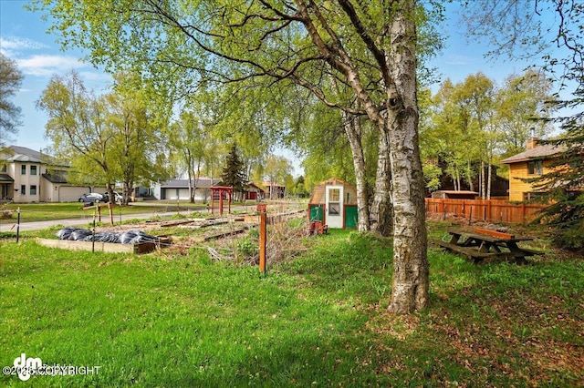 view of yard with a storage unit and an outdoor structure