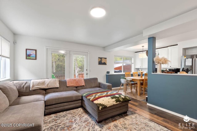 living room with wood finished floors and baseboards