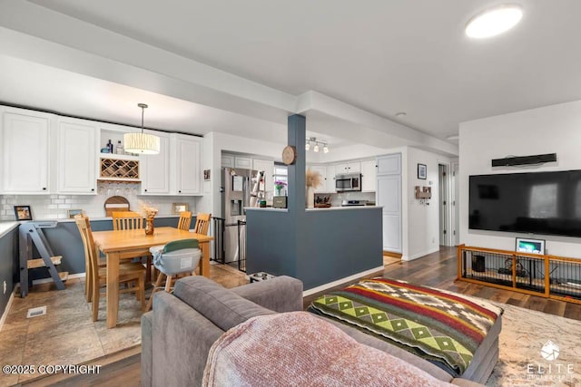 living area featuring wood finished floors and baseboards