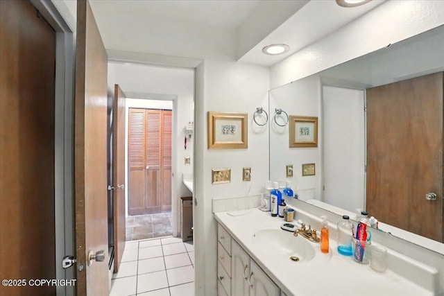 bathroom featuring vanity and tile patterned flooring