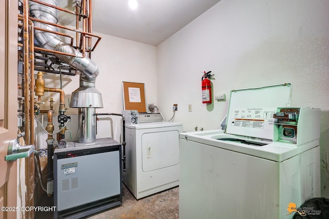 laundry room featuring washing machine and clothes dryer