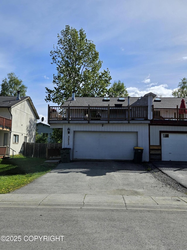 3213 Tayshee Cir, Anchorage, AK 99504 - multi unit property featuring driveway, an attached garage, and roof with shingles