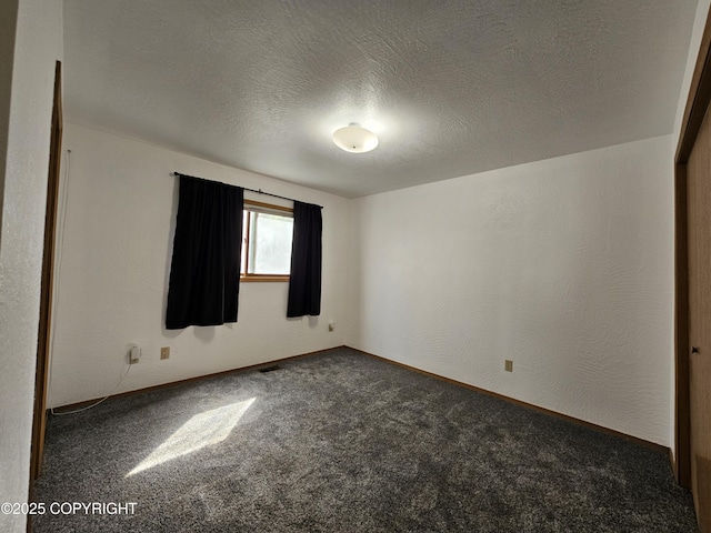 3213 Tayshee Cir, Anchorage, AK 99504 - empty room with carpet flooring, a textured ceiling, and baseboards