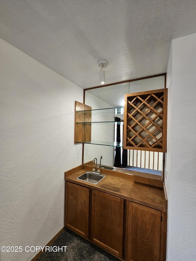 3213 Tayshee Cir, Anchorage, AK 99504 - indoor wet bar with baseboards, a textured ceiling, and dark colored carpet
