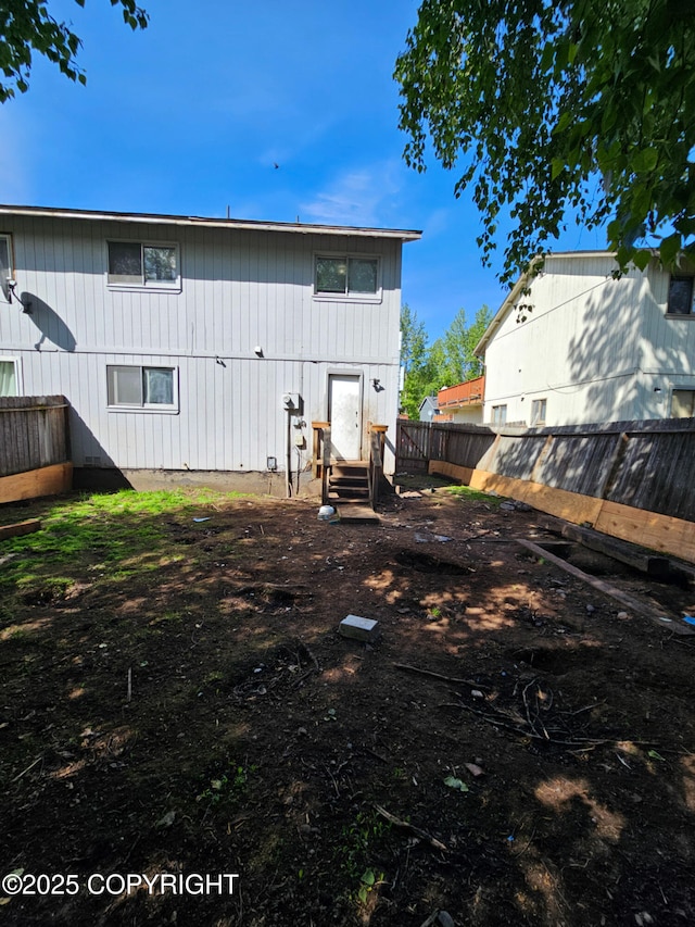 3213 Tayshee Cir, Anchorage, AK 99504 - rear view of property with entry steps