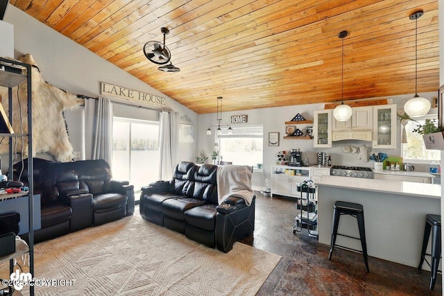living room with wooden ceiling, vaulted ceiling, and concrete floors