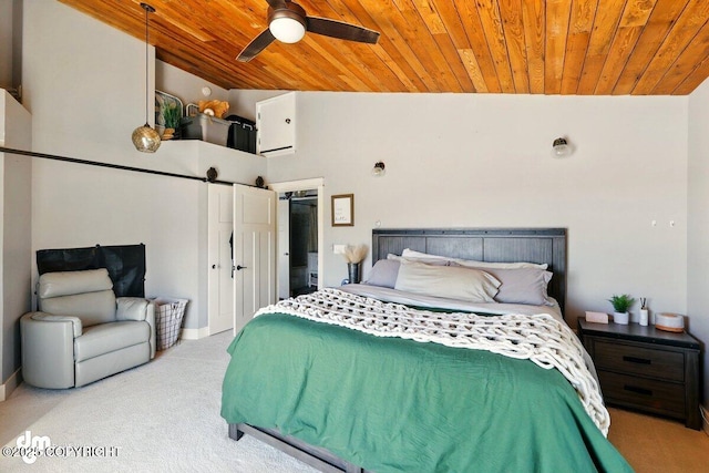 bedroom featuring carpet, wooden ceiling, vaulted ceiling, baseboards, and a barn door