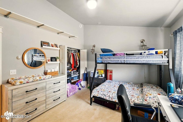 bedroom featuring light carpet and a closet
