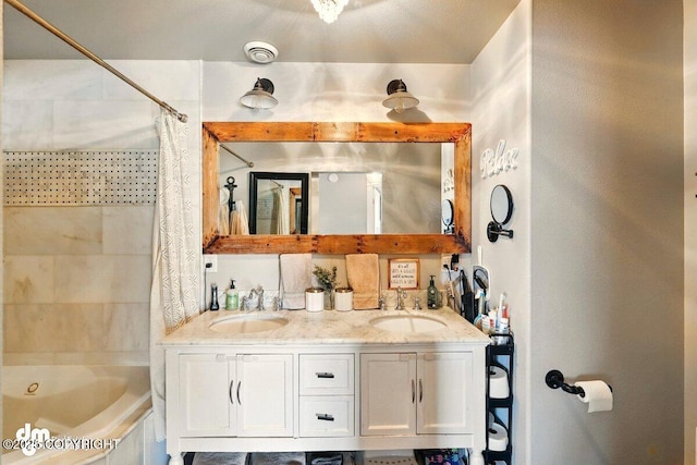 bathroom with double vanity and shower / tub combo