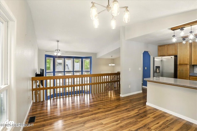9033 W Parkview Terrace Loop, Eagle River, AK 99577 - kitchen with stainless steel refrigerator with ice dispenser, brown cabinets, dark wood-type flooring, a chandelier, and ceiling fan