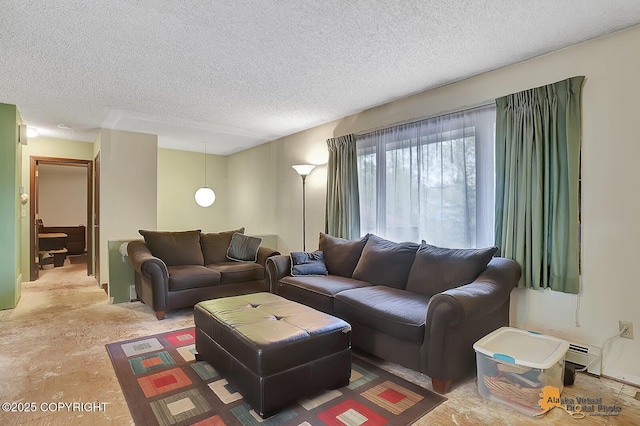 living area with a textured ceiling