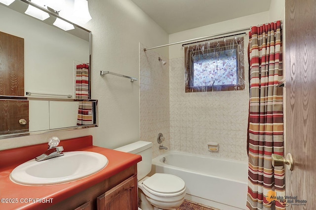 full bath with toilet, shower / bath combo with shower curtain, and vanity