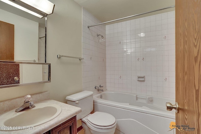 bathroom with shower / tub combination, vanity, and toilet
