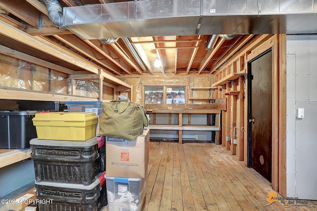 unfinished below grade area featuring hardwood / wood-style flooring