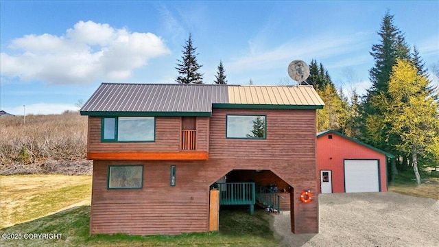 34540 Alamar, Anchor Point, AK 99556 - chalet / cabin with an outbuilding, driveway, a garage, and metal roof